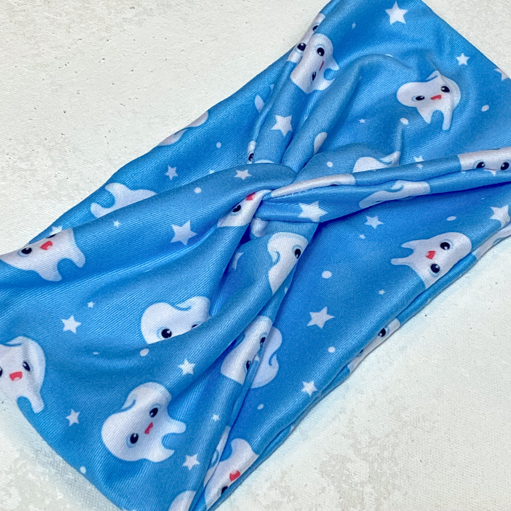 Wide fabric headband for women.  blue fabric with white tooth print