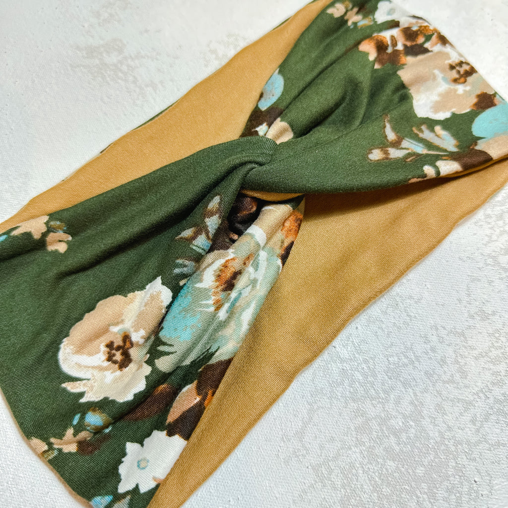 wide fabric turban headband.  olive green with floral print.  camel tan on the inside